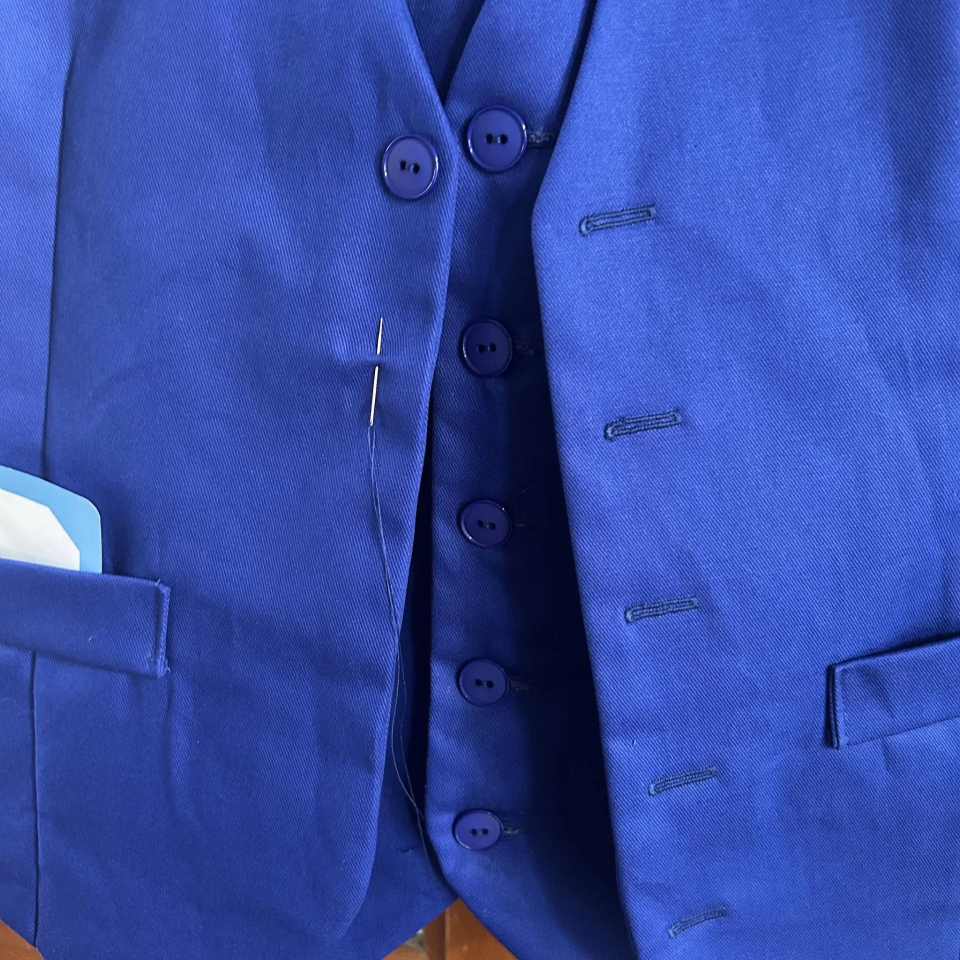 Blue suit alteration in progress
